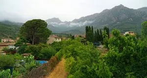 View of soller mallorca with low cloud in front of tramuntana mountains stockpack adobe stock